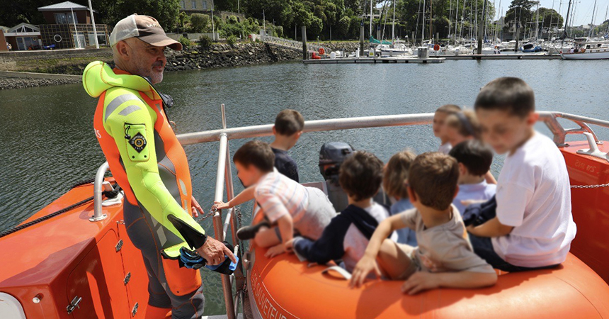 Martial on a boat with children